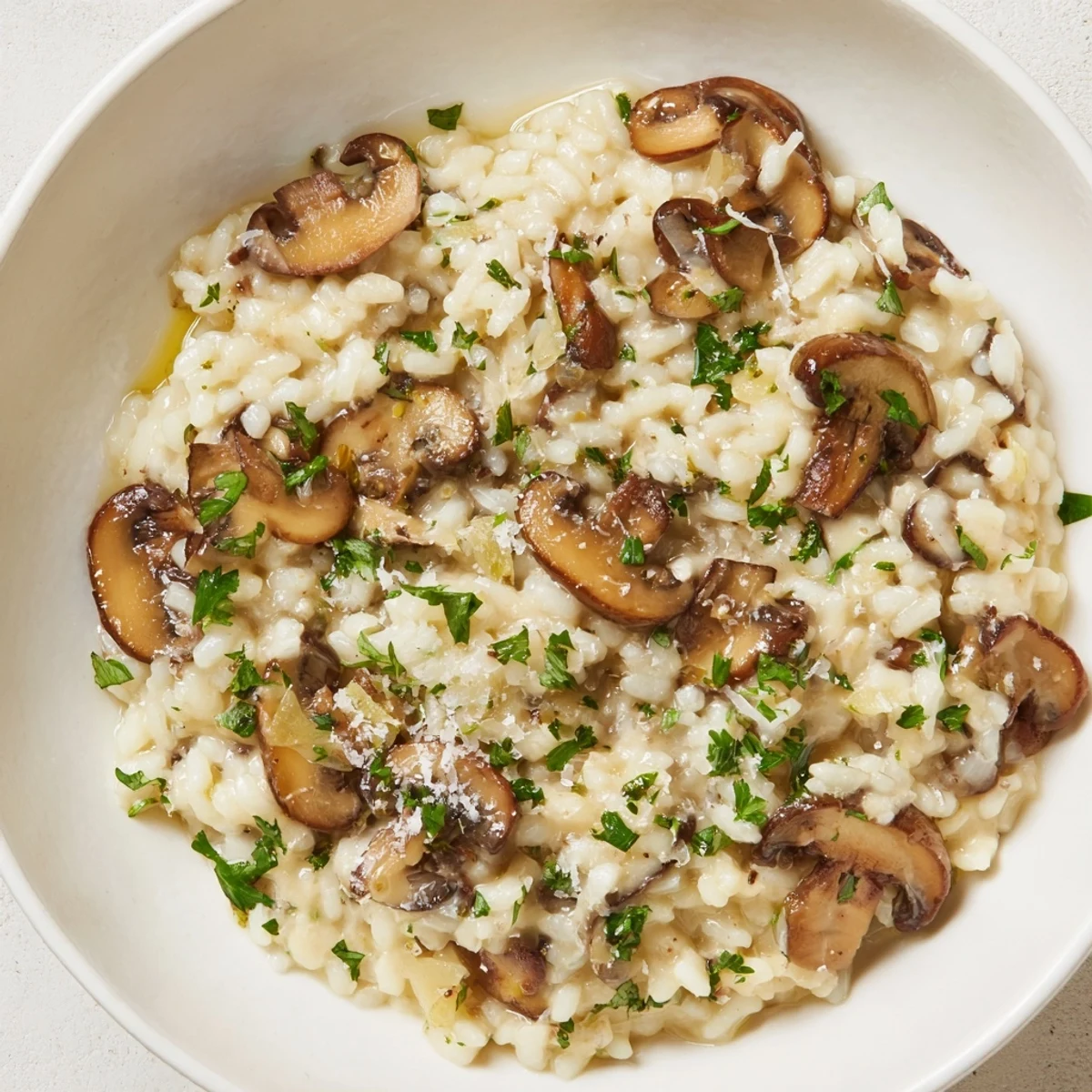A steaming bowl of Stove-Top Creamy Risotto, a comforting Italian dinner with Parmesan.