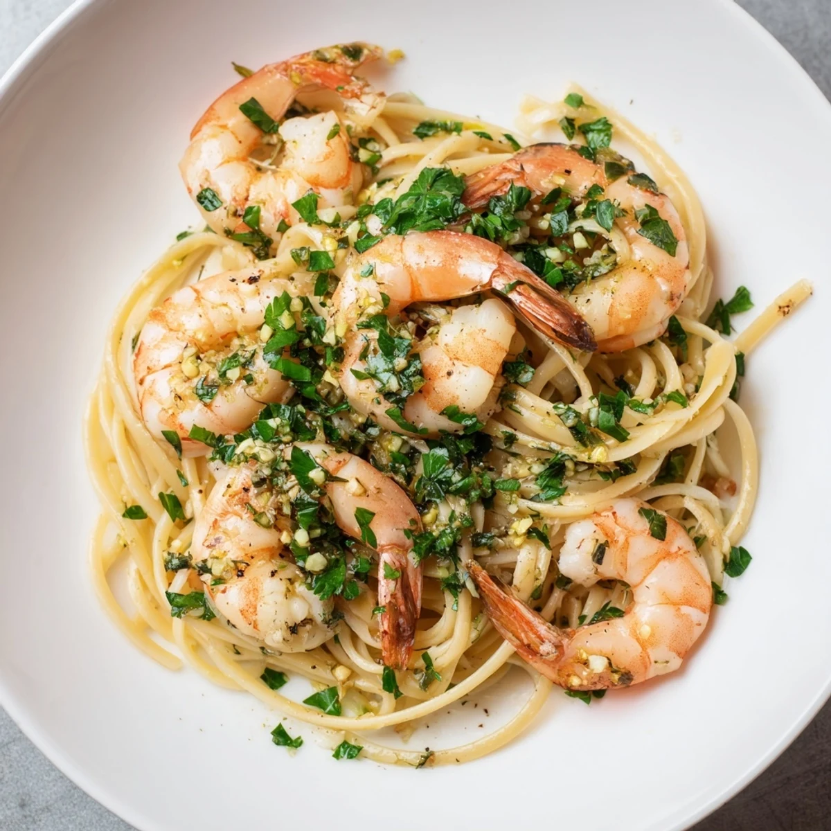 Steaming bowl of Lemon Herb Pasta with Shrimp, bright and flavorful, ready to be enjoyed.