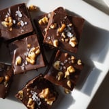 Rich, dark chocolate forms the base of this smooth, homemade Easy Chocolate Fudge treat with optional nuts.