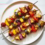 Tender chicken and colorful vegetables on Chicken and Veggie Skewers, ready for a healthy and easy dinner.