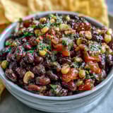 Vibrant 3-ingredient cowboy caviar dip with black beans, corn, and fresh pico de gallo for a zesty snack.  