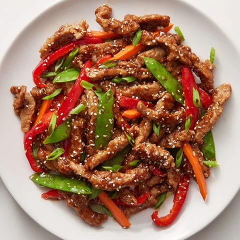 Sweet Teriyaki Pork Stir-Fry boasts tender pork and colorful vegetables in a sweet and savory sauce.