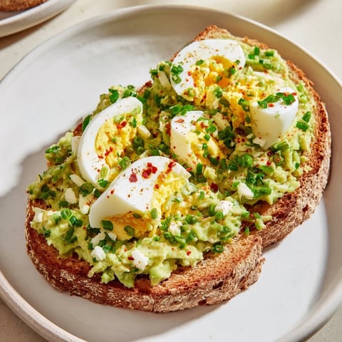 Creamy Avocado Egg Smash on toasted bread, a bright and flavorful vegetarian breakfast option.