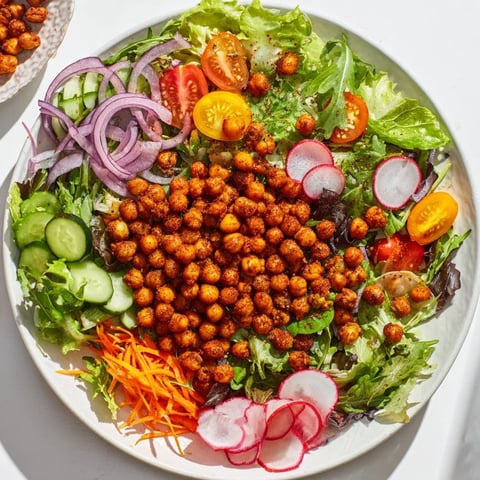 Mixed Greens Salad featuring golden, crunchy chickpea croutons adding delicious, irresistible texture.