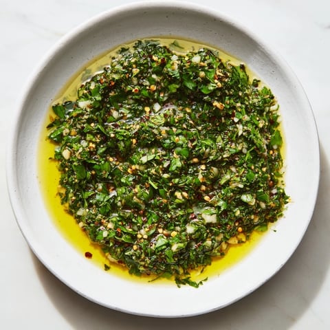 Vibrant Moroccan Chermoula Marinade ready to flavor fish, showcasing fresh herbs and a bright lemon hue!