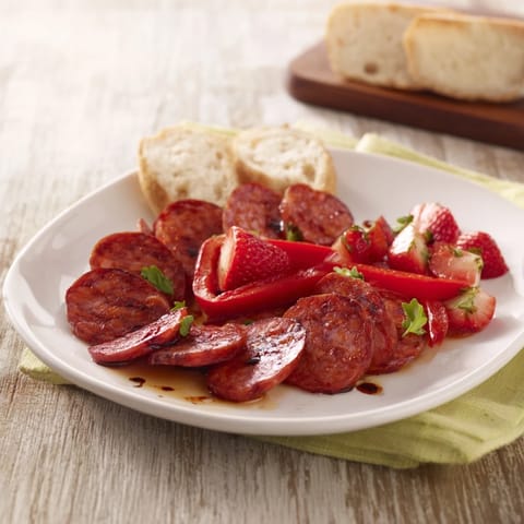 The Crimson Tide appetizer: Spicy chorizo, sweet cherries, and red peppers create a flavorful S-shape atop crackers.