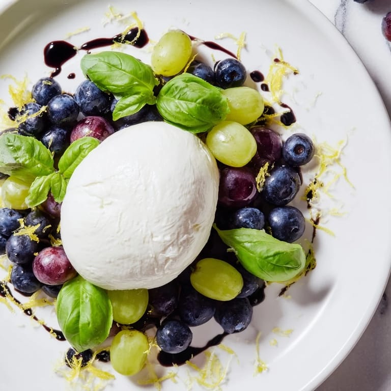This Moonlit Lagoon salad showcases a creamy burrata moon surrounded by glistening dark berries.