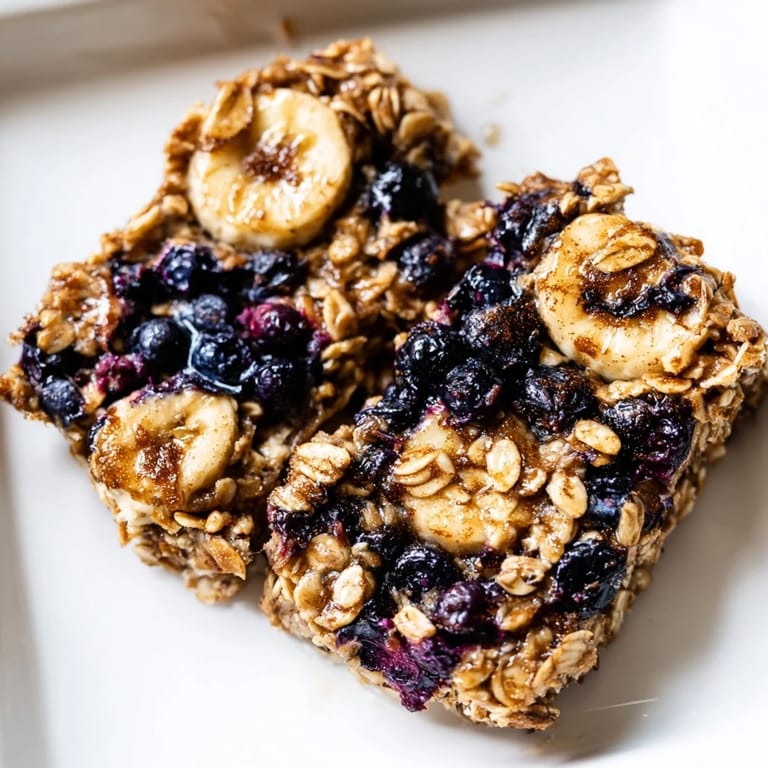Enjoy a wholesome Blueberry Banana Oatmeal Protein Bar! Soft, easy snack with juicy blueberries and protein.