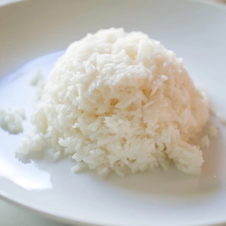 Flavorsome Coconut Jasmine Rice glistens, ready to serve alongside flavorful stir-frys and curries tonight.