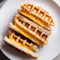 Golden, crispy Waffle Grilled Cheese, oozing melted cheddar, a delightful and simple lunch idea.